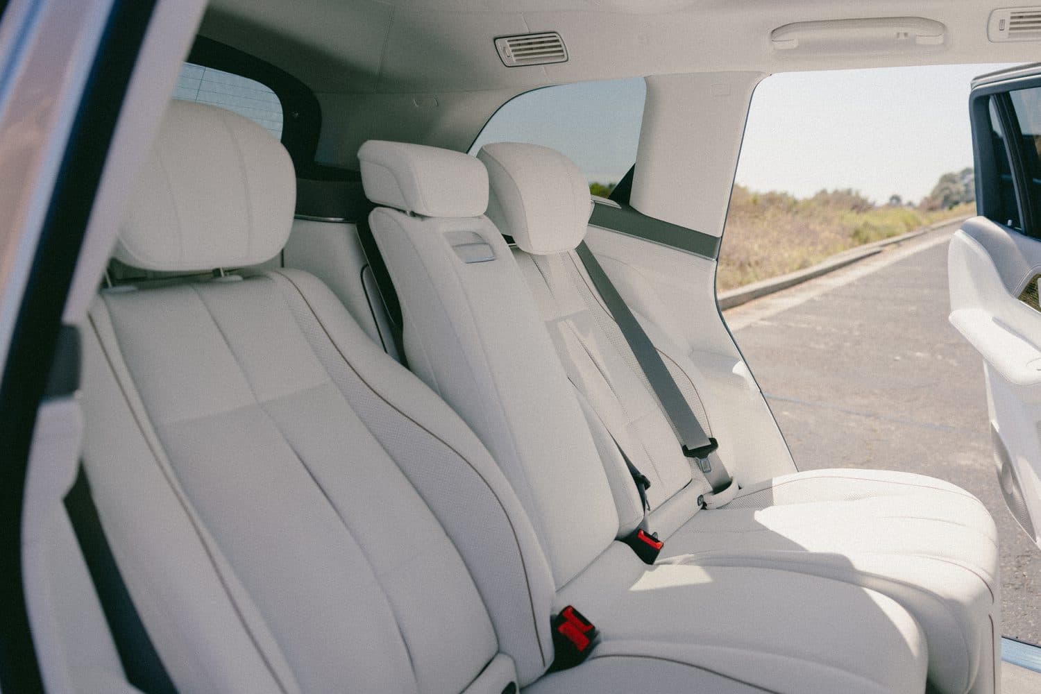 Mercedes-Maybach GLS rear cabin in white leather — reclining executive seats and panoramic glass roof