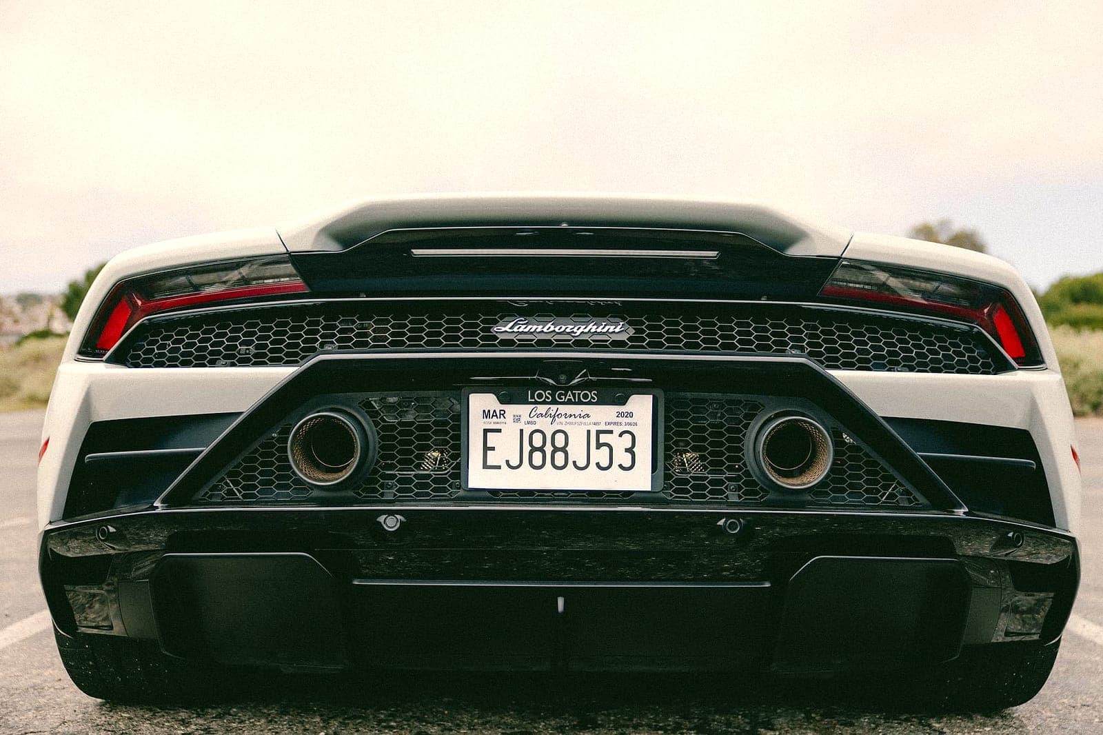 White Lamborghini Huracán rear with quad exhaust